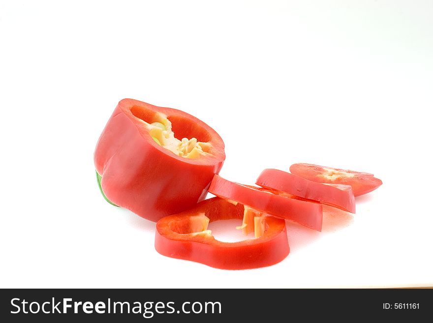 A red bell pepper, cut in slices. A red bell pepper, cut in slices