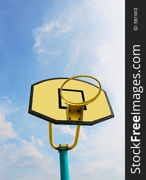 The backboard with a blue sky background .