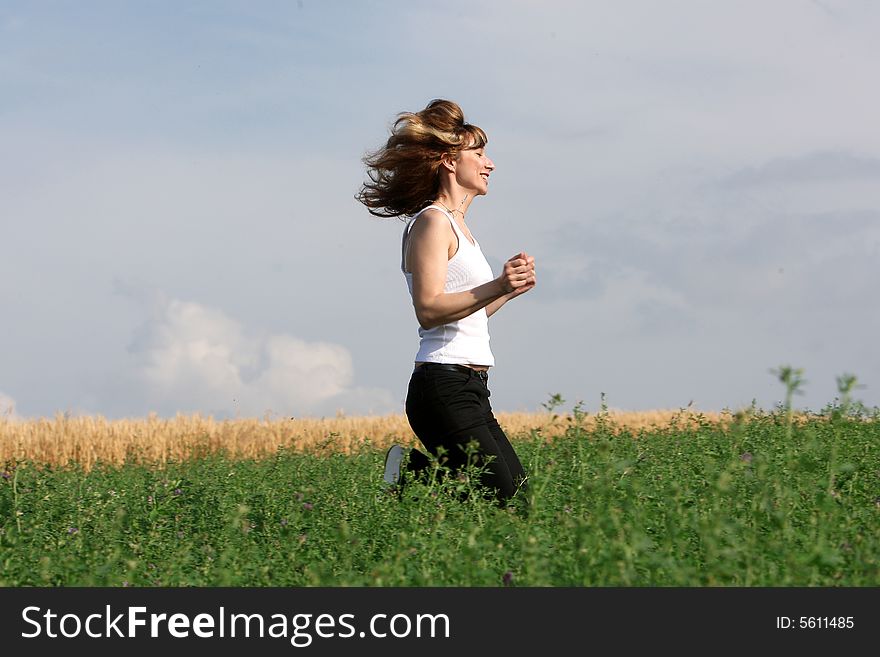 A beautiful girl running on the field