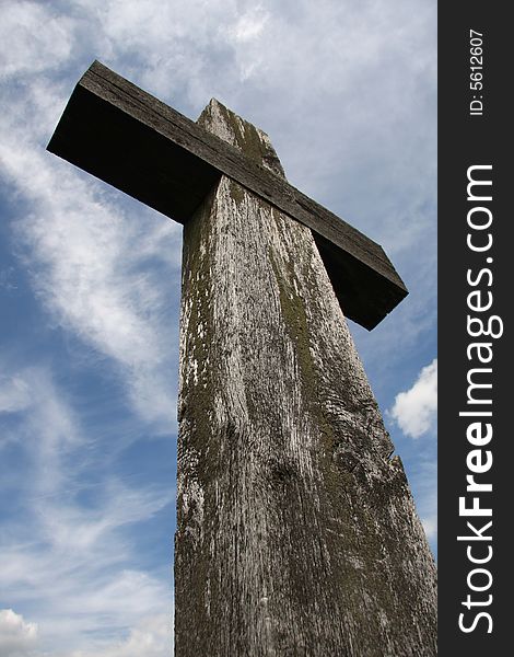 Wooden cross against a blue sky