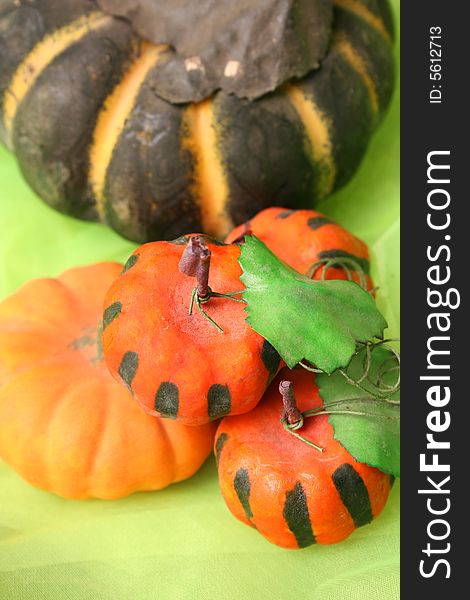 Dusty Old Halloween pumpkins on a green background