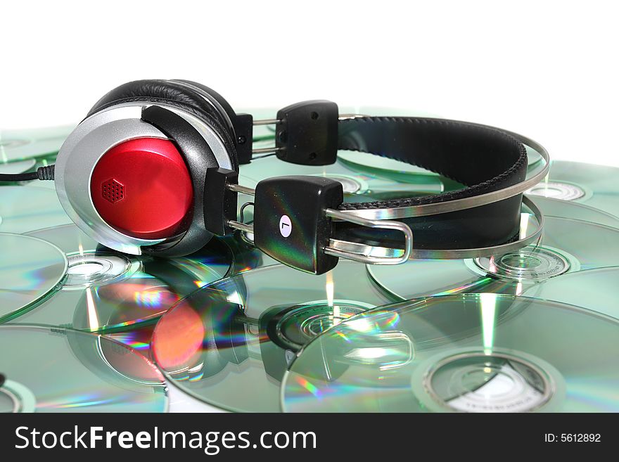 Headphones and CD on white background