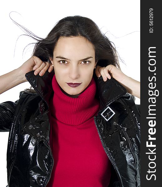 Portrait of a beautiful model holding her black leather jacket over white background. Portrait of a beautiful model holding her black leather jacket over white background.