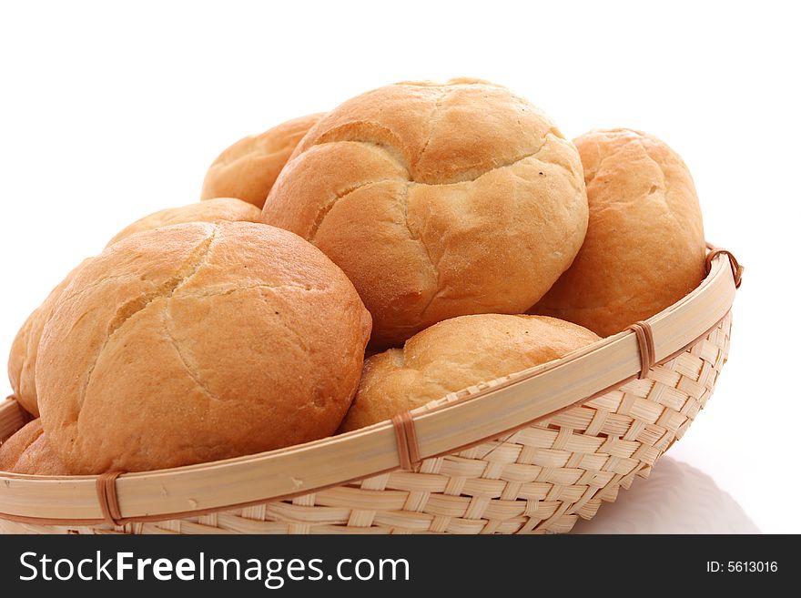 Fresh baked rolls on white background