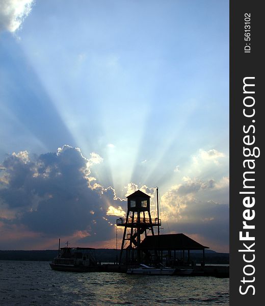 Sunset at wharf on Memphremagog Lake in Magog, Province of Quebec, Canada. Sunset at wharf on Memphremagog Lake in Magog, Province of Quebec, Canada