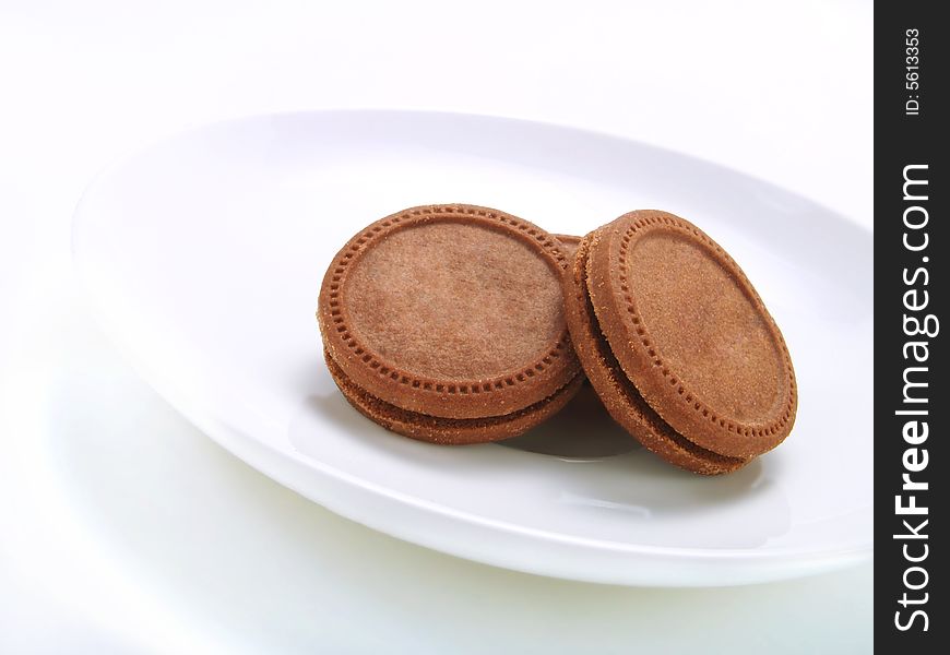 Crispy biscuits on a white plate. Crispy biscuits on a white plate