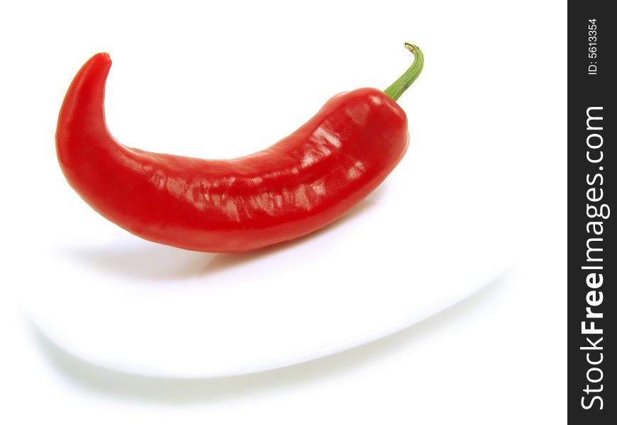 Fresh red chili pepper on white plate and isolated on white background