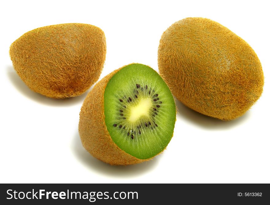 A group of cut and whole kiwis isolated on white background. A group of cut and whole kiwis isolated on white background