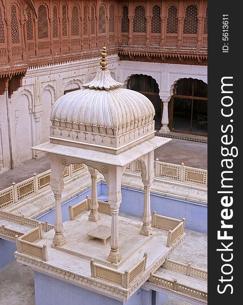 White marble dome, fully engraved, supported by four pillars over a basin in Junagarh palace, Bikaner, Rajasthan, India. White marble dome, fully engraved, supported by four pillars over a basin in Junagarh palace, Bikaner, Rajasthan, India.