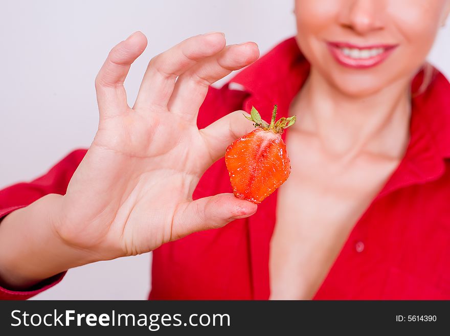 Sexy girl with red strawberry isolated on white