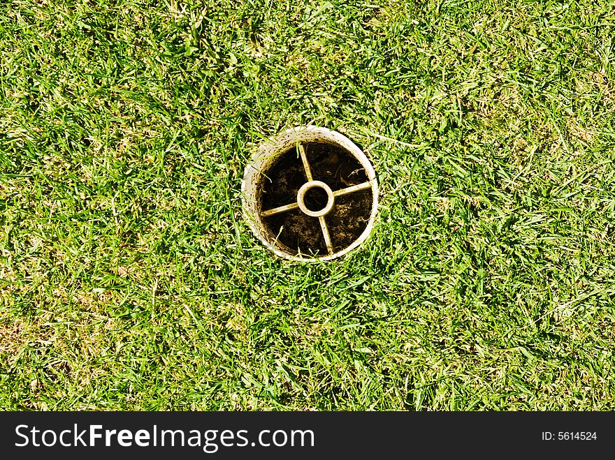 A pitch and putt green in an urban park. A pitch and putt green in an urban park