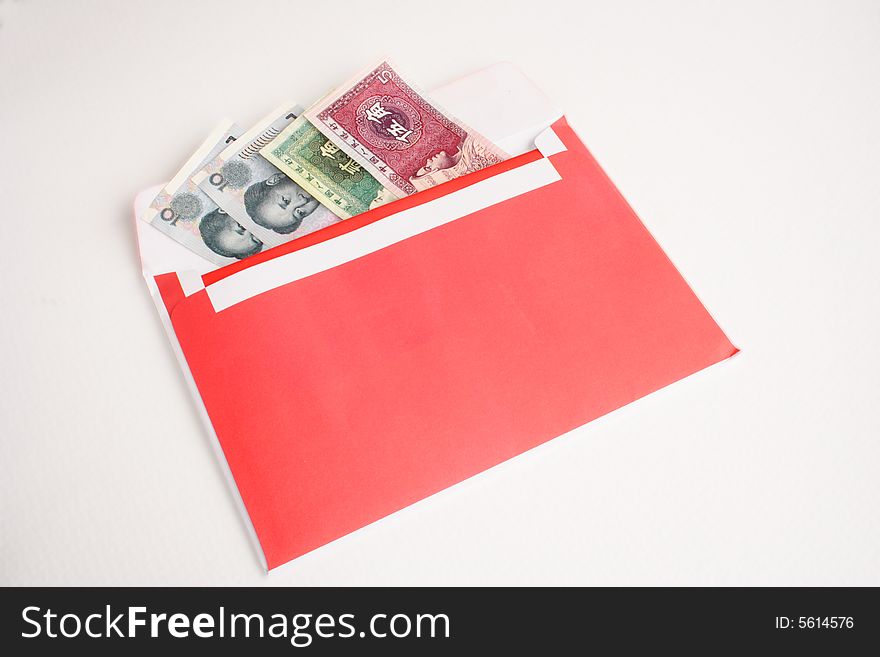 Chinese money in a red envelope isolated. Chinese money in a red envelope isolated