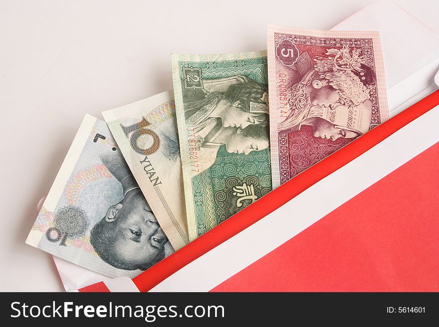 Close up of Chinese money in red envelope. Close up of Chinese money in red envelope