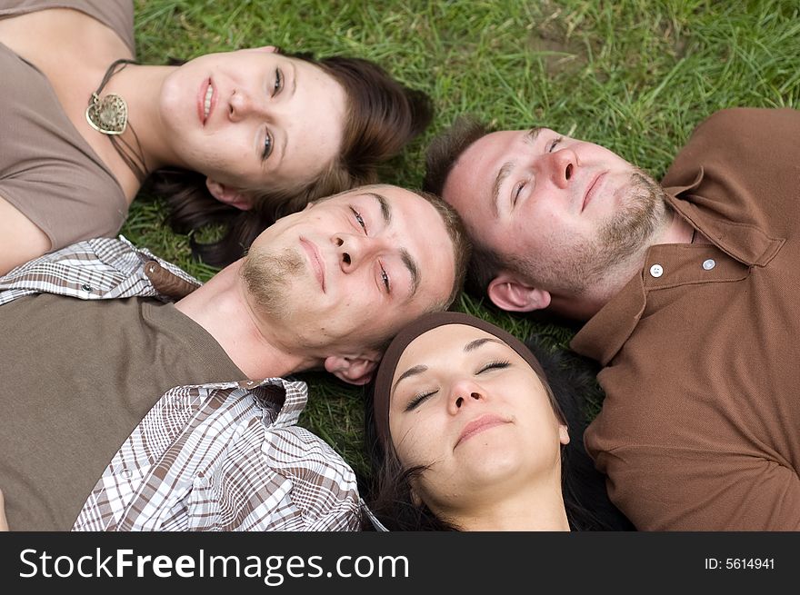 Friends together relaxing on grass. Friends together relaxing on grass