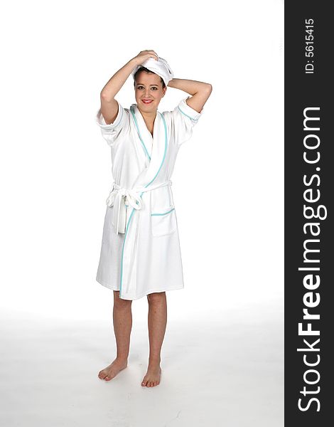 Teen in white robe with towel on hair like she's at the spa. Teen in white robe with towel on hair like she's at the spa