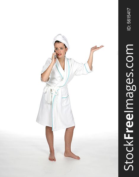 Teen in towel and robe on phone with hand out