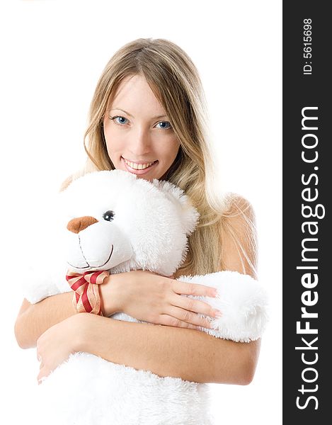 Close-up lovely young blonde girl with teddy bear isolated on white background