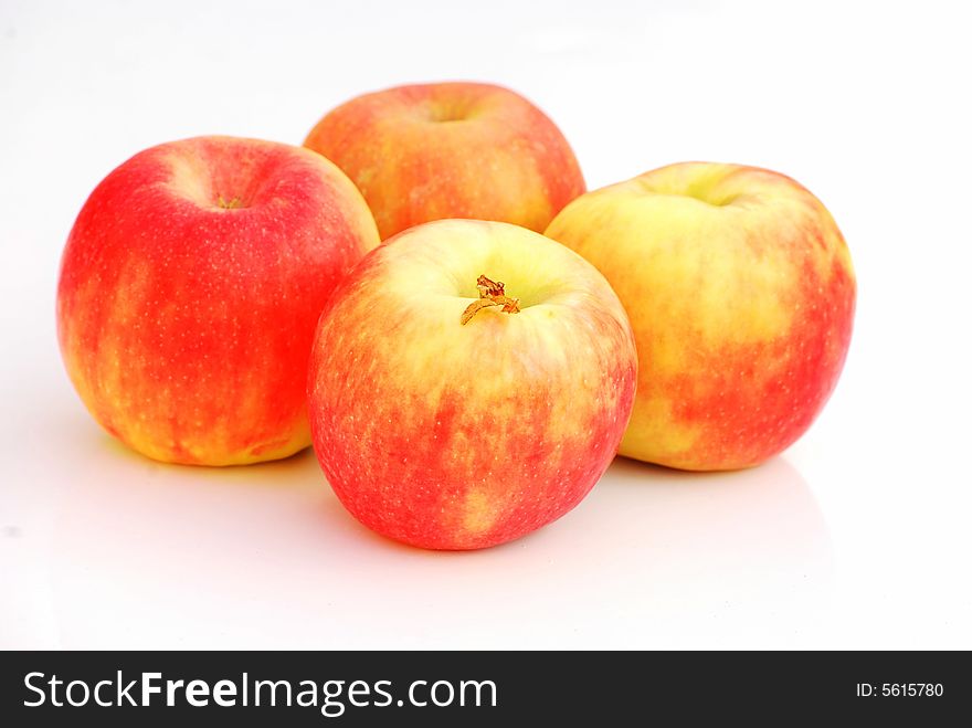 A shot of four organic apples isolated on white