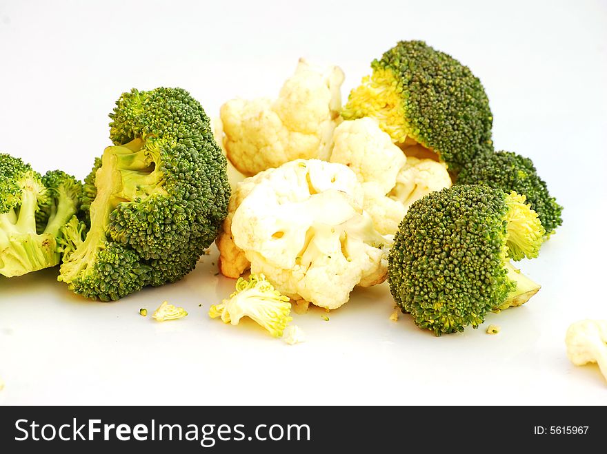 A shot of some broccoli and cauliflower florets isolated on white
