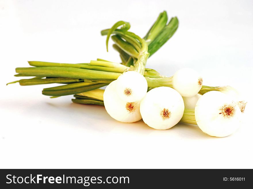 A shot of some spring onions isolated on white