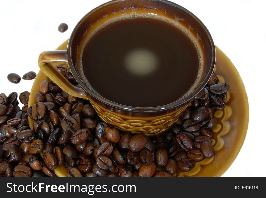 Cup of coffee with coffee beans isolated on the white background