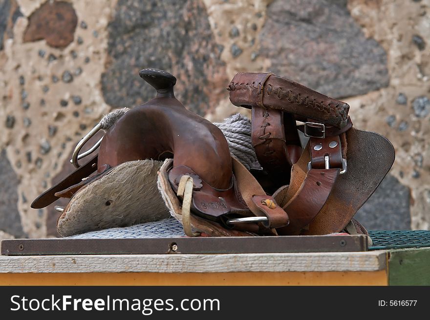 Close up image of an old leather saddle