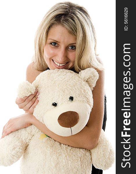 Close-up lovely young blonde girl with teddy bear isolated on white background