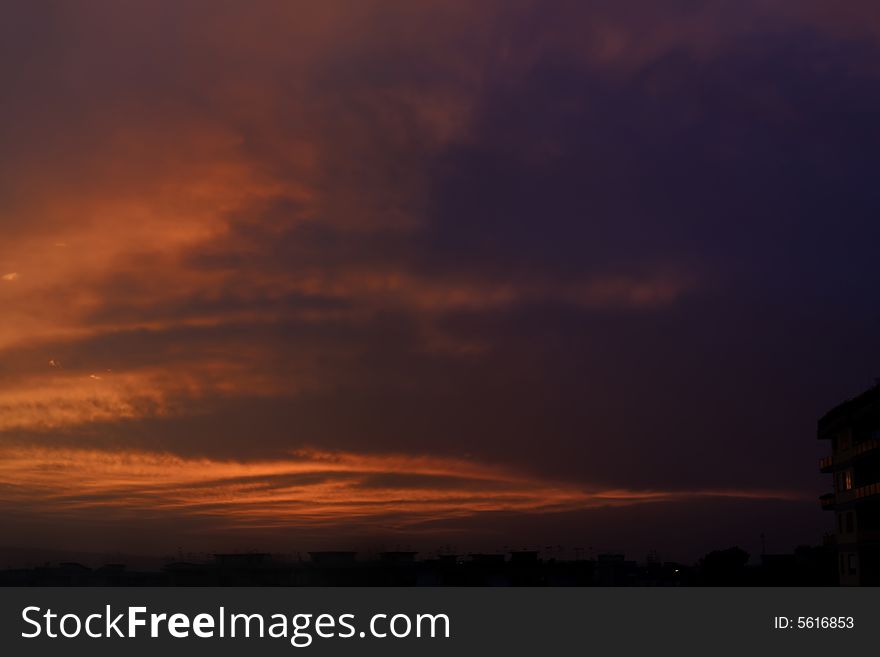 A city in a red sea at the sunset. A city in a red sea at the sunset