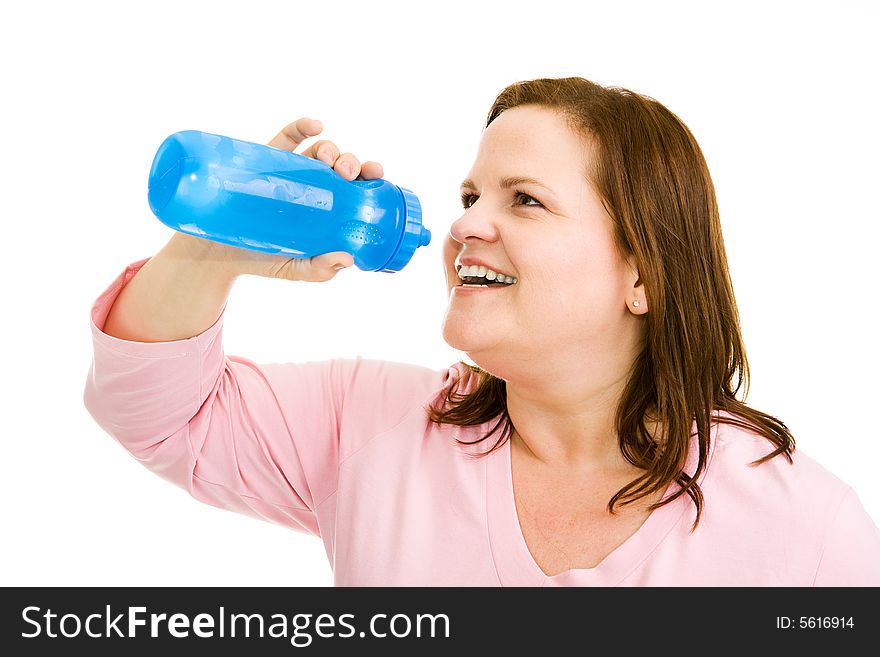 Beautiful plus-sized woman drinking water after her workout. Isolated on white. Beautiful plus-sized woman drinking water after her workout. Isolated on white.