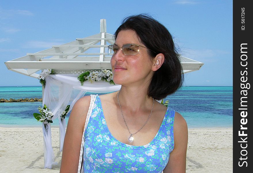 The girl portrait by the arbour, popular place to marry on Our Lucaya town beach, Grand Bahama Island (The Bahamas). The girl portrait by the arbour, popular place to marry on Our Lucaya town beach, Grand Bahama Island (The Bahamas).