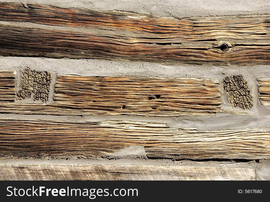 Log cabin detail from building circa 1855. Renovation is preserving the building which features rich weathered hand hewn logs. Log cabin detail from building circa 1855. Renovation is preserving the building which features rich weathered hand hewn logs.