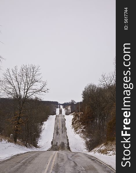 Vertical shot of rural midwestern road in winter. Vertical shot of rural midwestern road in winter