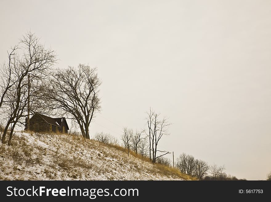 House on top of a hill in winter. House on top of a hill in winter