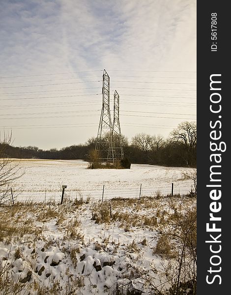 Rural power line towers in winter field. Rural power line towers in winter field