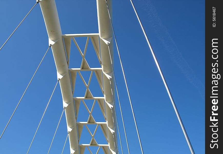 A modern suspension bridge on clear blue sky day,