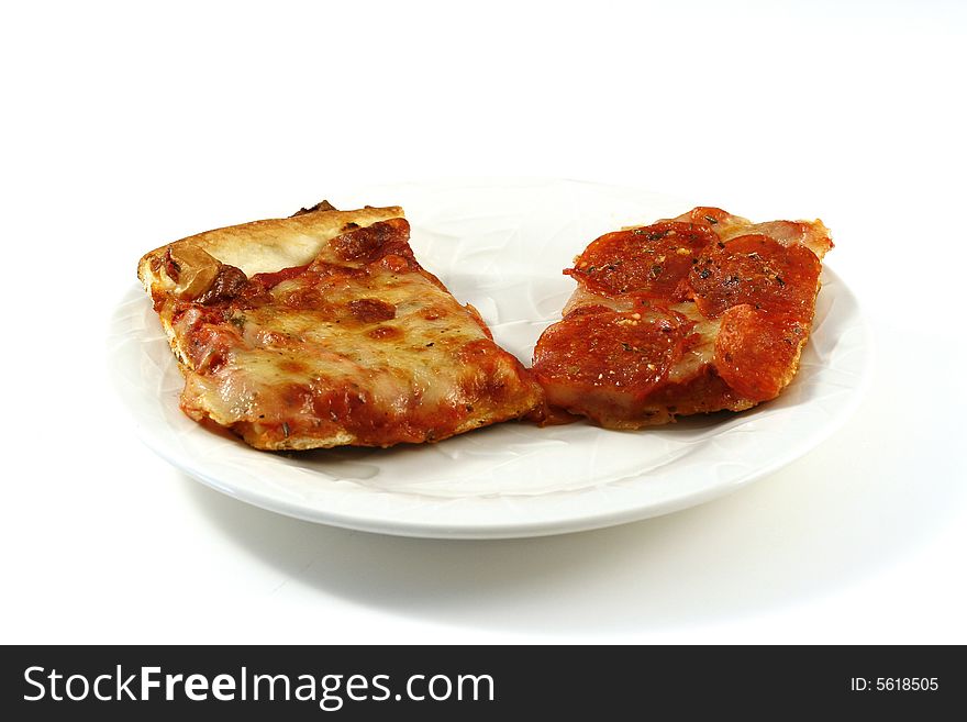 A slice of cheese and a slice of pepperoni pizza on a white plate, over a white background with room for copy. A slice of cheese and a slice of pepperoni pizza on a white plate, over a white background with room for copy.