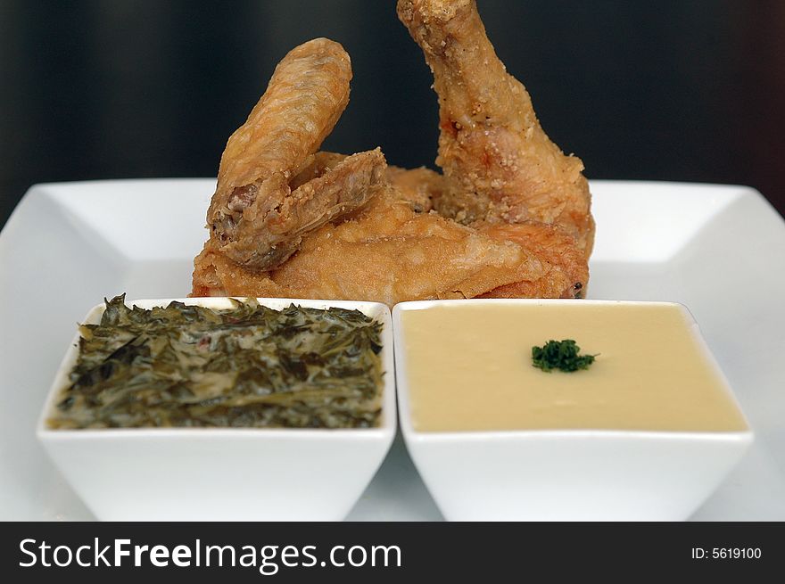 Southern fried chicken with creamed spinach and mashed potatoes. Southern fried chicken with creamed spinach and mashed potatoes