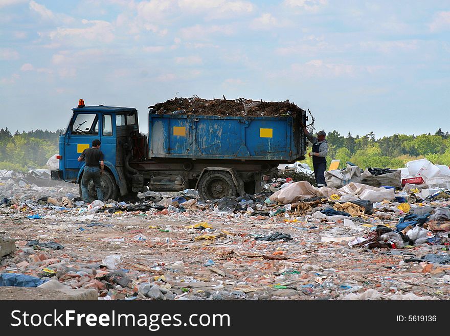 Trash pickup at work on the dump - Szadolki - Gdansk. Trash pickup at work on the dump - Szadolki - Gdansk