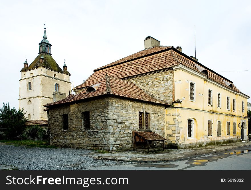 An image of two old yellow buildings. An image of two old yellow buildings