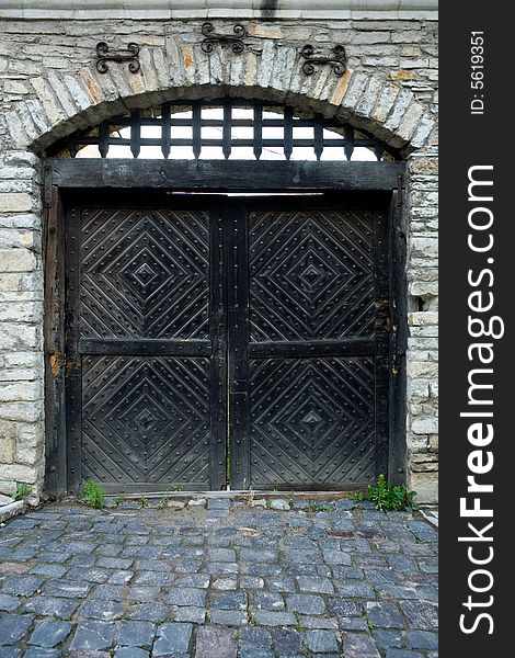 An image of iron door of a fortres. An image of iron door of a fortres