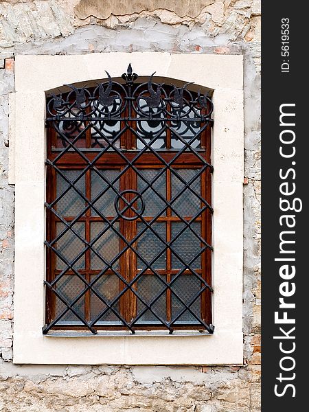 AN image of a window with black grates