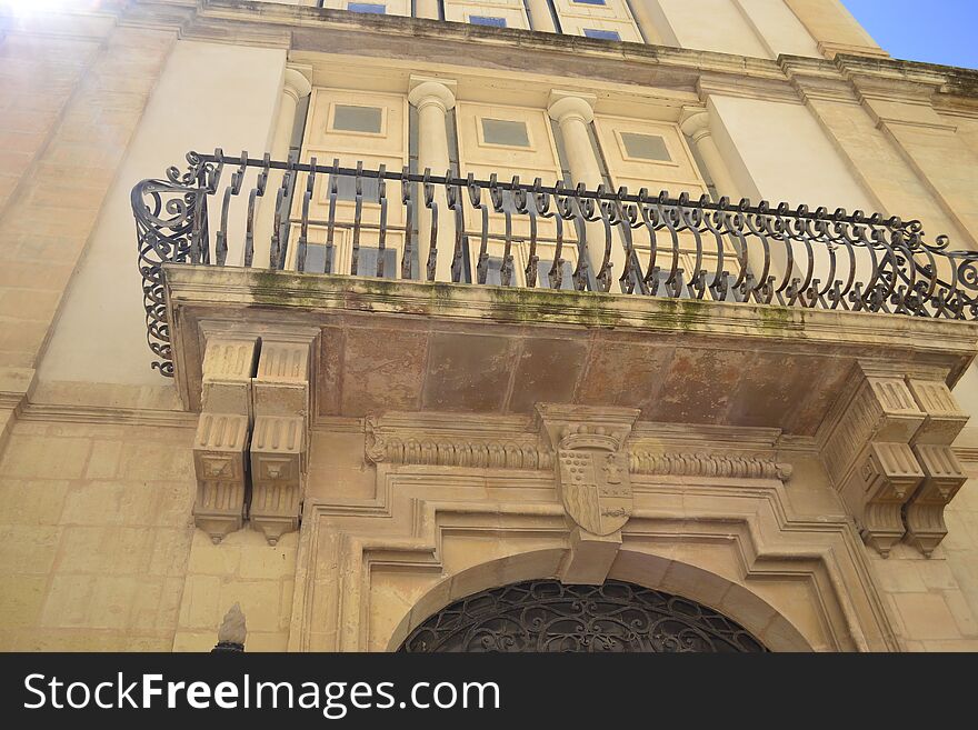 Ancient windows and balconies of a building in the classical style