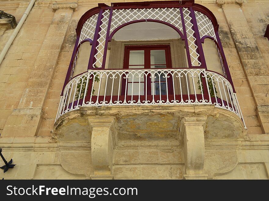 Ancient windows and balconies of a building in the classical style