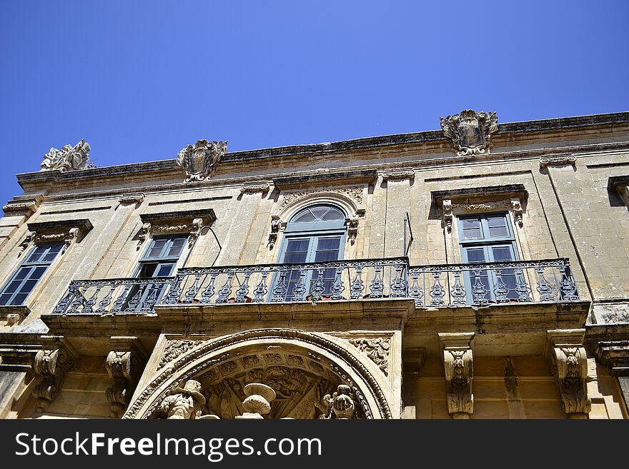 Ancient windows and balconies of a building in the classical style