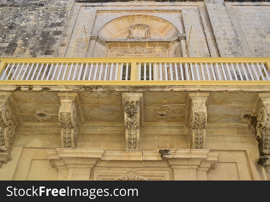 Ancient windows and balconies of a building in the classical style