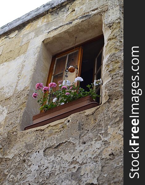 Ancient windows and balconies of a building in the classical style