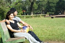 Man And Woman On A Park Bench - Horizontal Royalty Free Stock Photos
