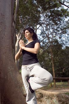 Woman In Yoga Pose Next To Tree - Vertical Royalty Free Stock Image Woman In Yoga Pose Next To Tree - Vertical Royalty Free Stock Image