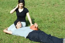 Man And Woman Sitting On Grass - Horizontal Royalty Free Stock Photos Man And Woman Sitting On Grass - Horizontal Royalty Free Stock Photos
