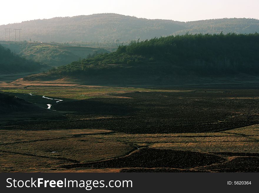 Farmland disappearing from my sight. There's a beautiful place of my home town, but, The government will use it for development, soon there will be a lost land.